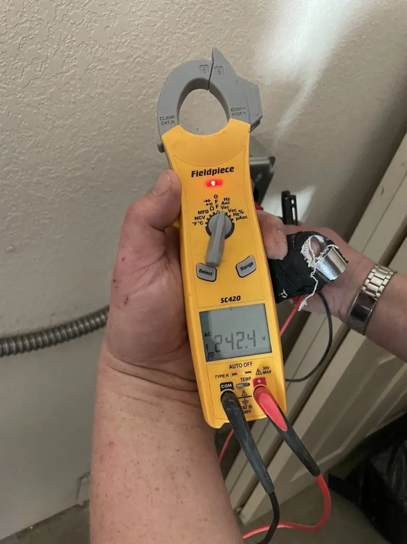 Voltage testing with clamp meter during Generator Installation in Orange